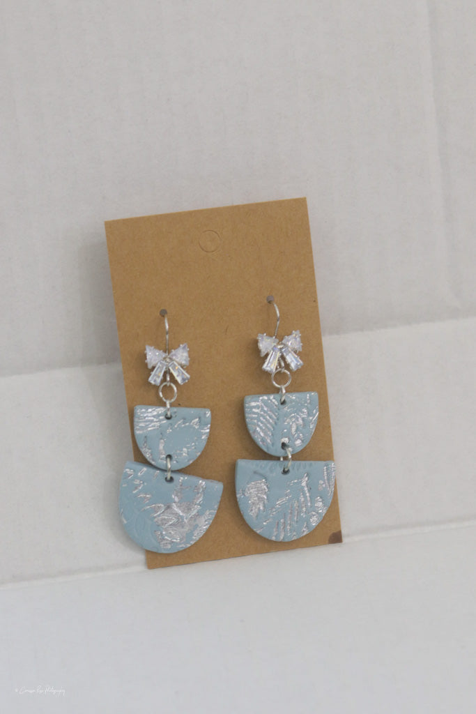 Light blue silver bow sparkle dangle earrings
