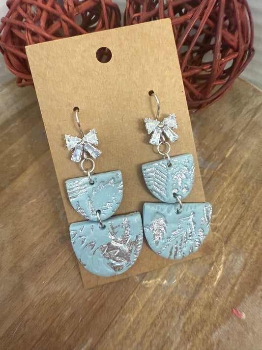 Light blue silver bow sparkle dangle earrings